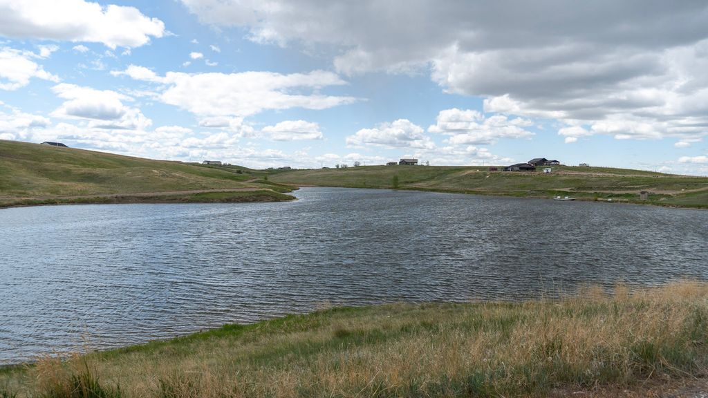 Open reservoir water and grassy banks in Central Montana